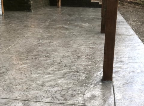 Concrete floor with wood support column in an empty industrial or warehouse space
