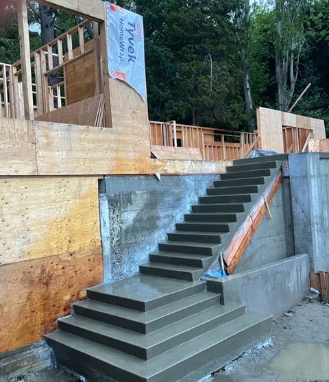 Black concrete stairs with metal railings